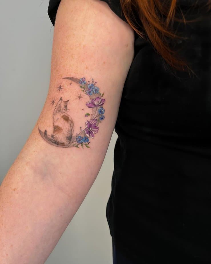 Cat on a moon tattoo