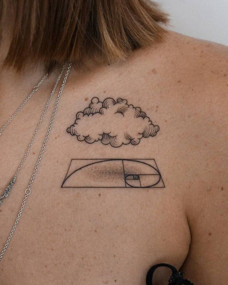 Cloud and golden spiral tattoo