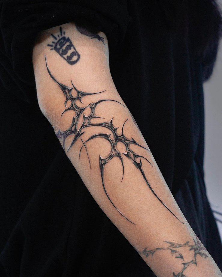 Cyber-tribal tattoo on arm