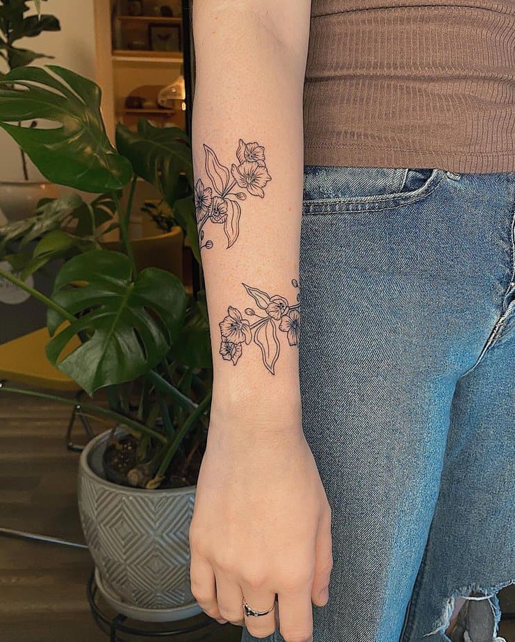 Delicate apple blossom tattoo