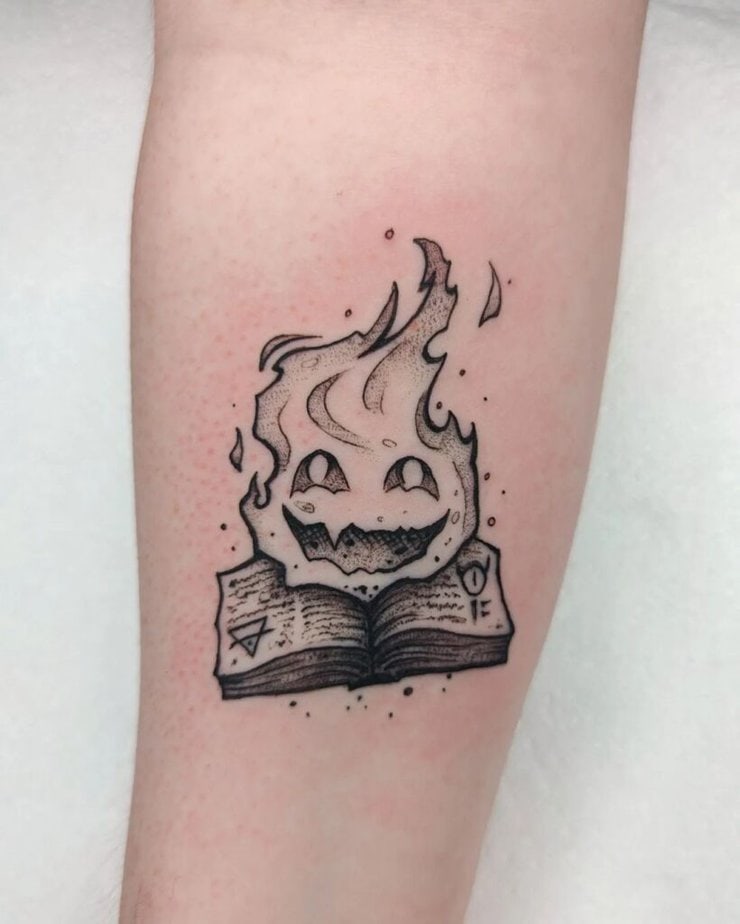 Enchanted tattoo of black and gray designs