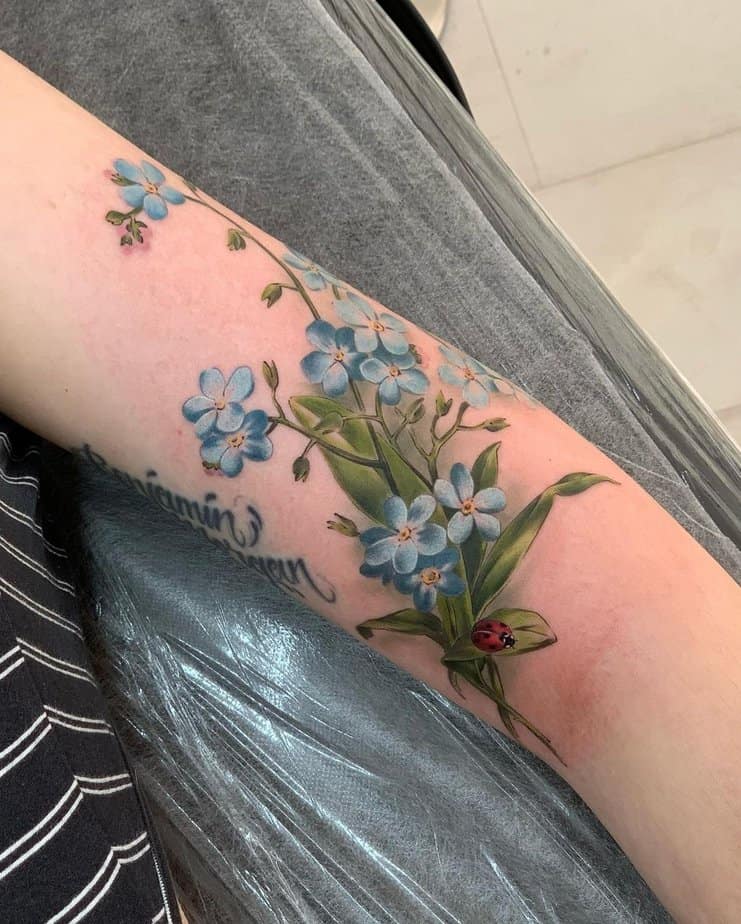 Forget me not and ladybug tattoo