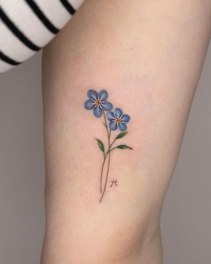 Forget me not with initial tattoo