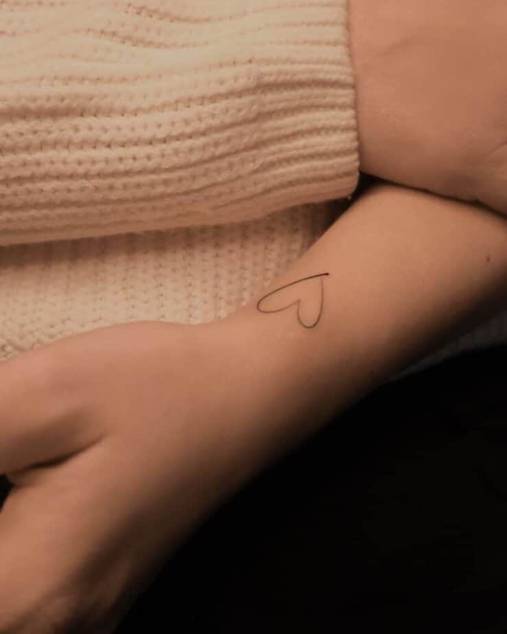 11. A fine-line heart tattoo