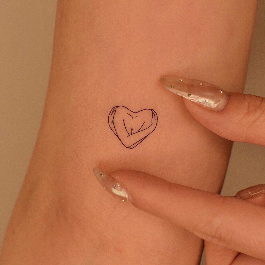 12. A heart hug tattoo