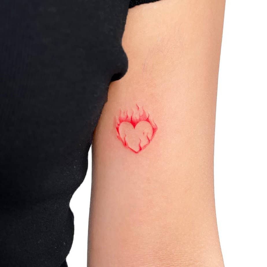 18. A tattoo of a heart on fire