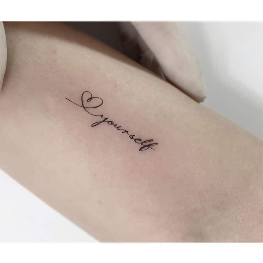 2. A heart tattoo with a mantra