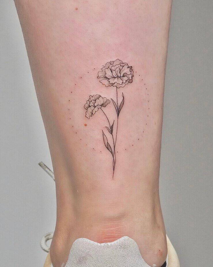 Geometric marigold calf tattoo