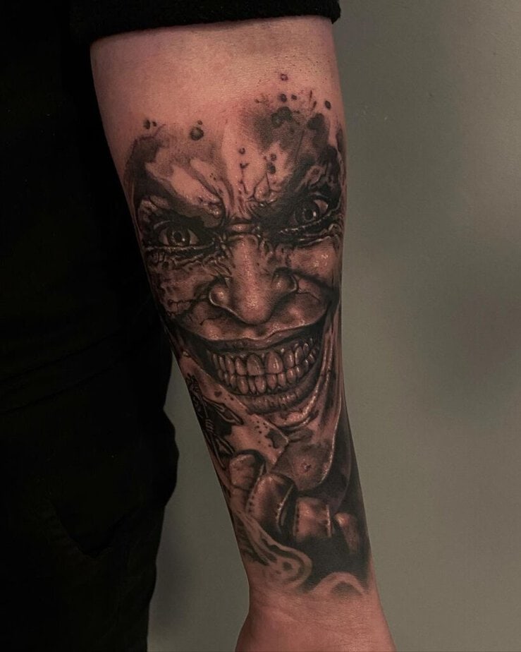 23. A close-up tattoo of Joker&rsquo;s face