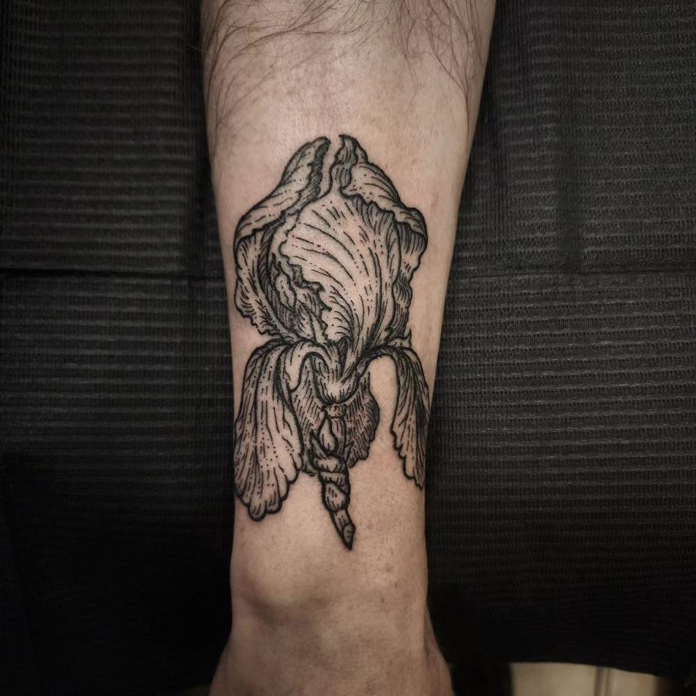 Iris flower wrist tattoo