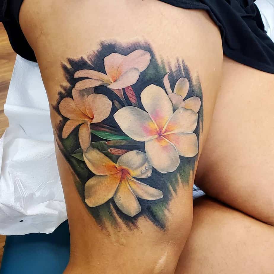 Life-like plumeria blooms tattoo
