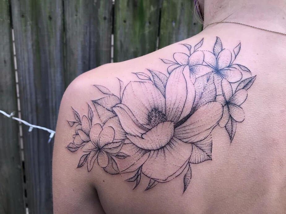 Magnolia and plumerias tattoo