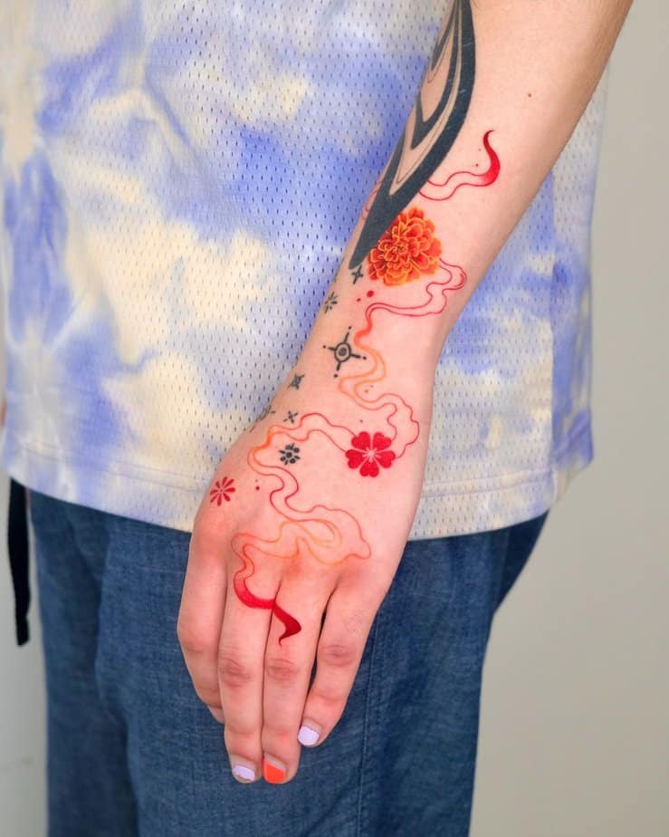 Marigold flowers with red smoke tattoo