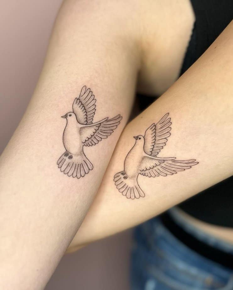 Matching dove tattoos