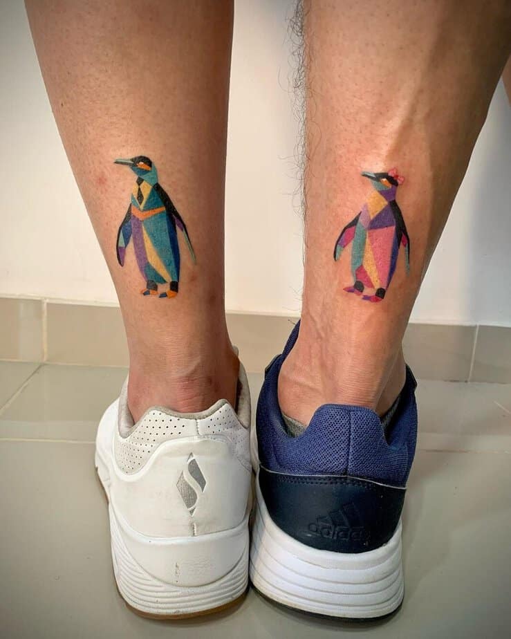 Matching penguin tattoos