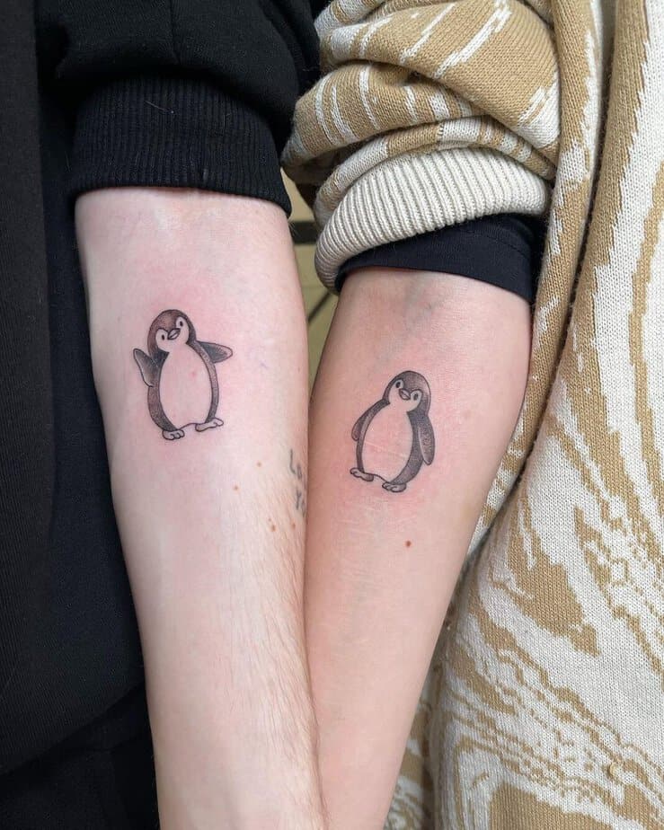 Matching penguin tattoos 3