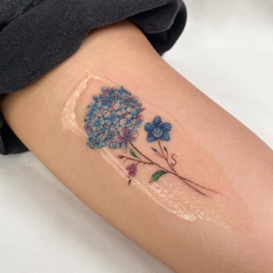 Minimalistic forearm floral tattoo