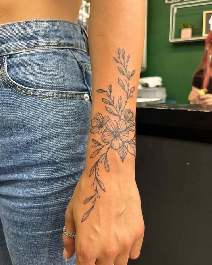 Minimalistic forearm floral tattoo