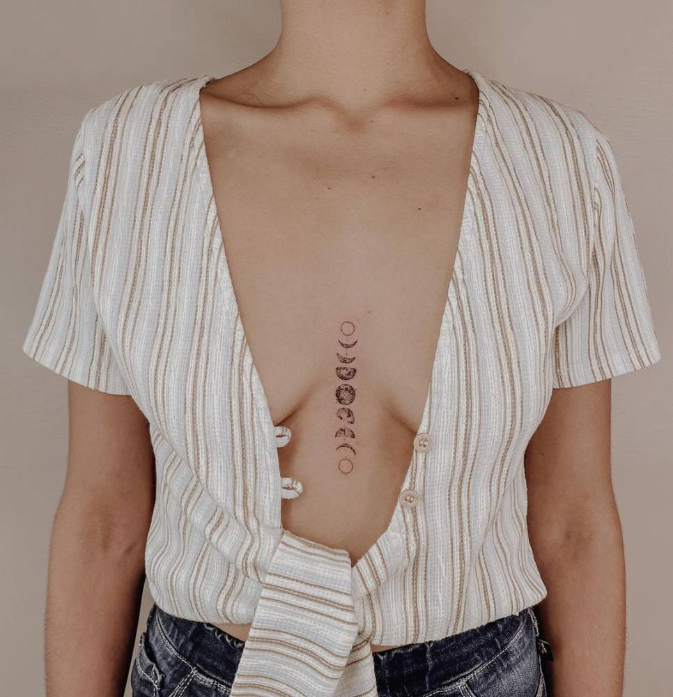 Moon phases sternum tattoo