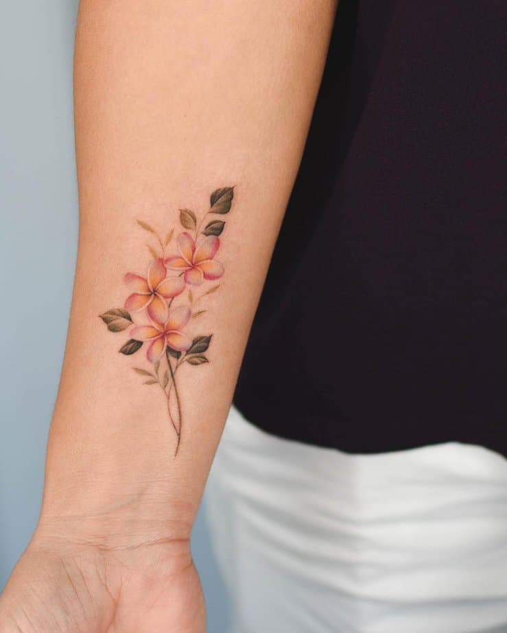 Orange plumeria tattoo