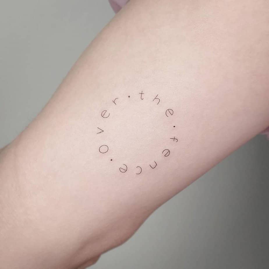 Over the Fence circle tattoo