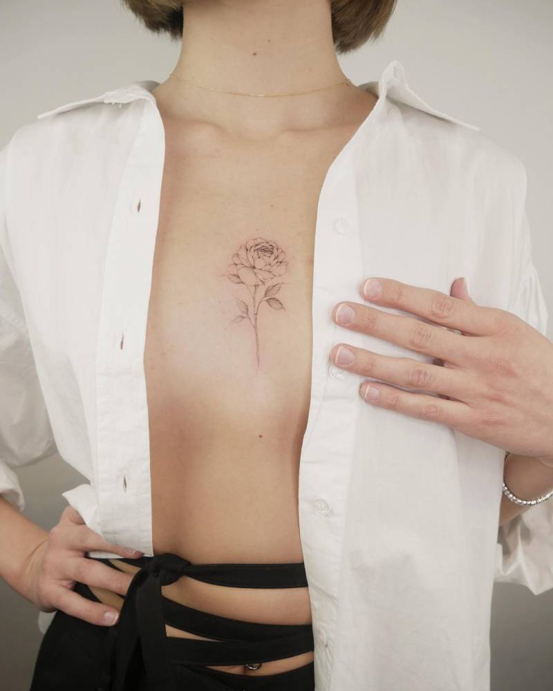 Peony sternum tattoo