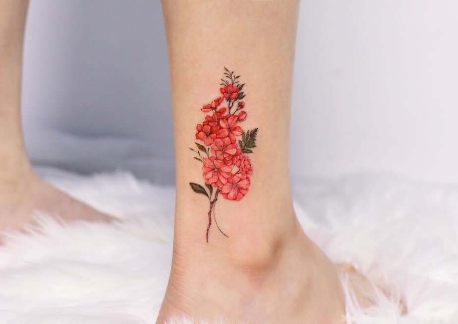 Red apple blossom tattoo