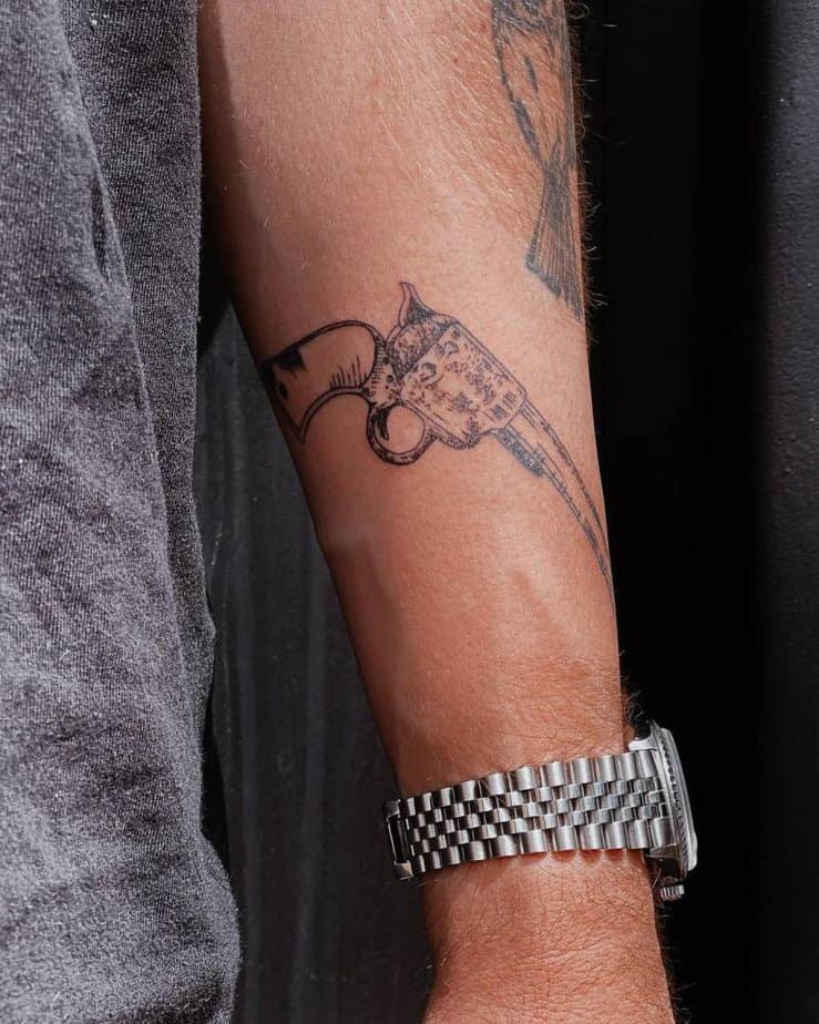 Revolver engraving tattoo