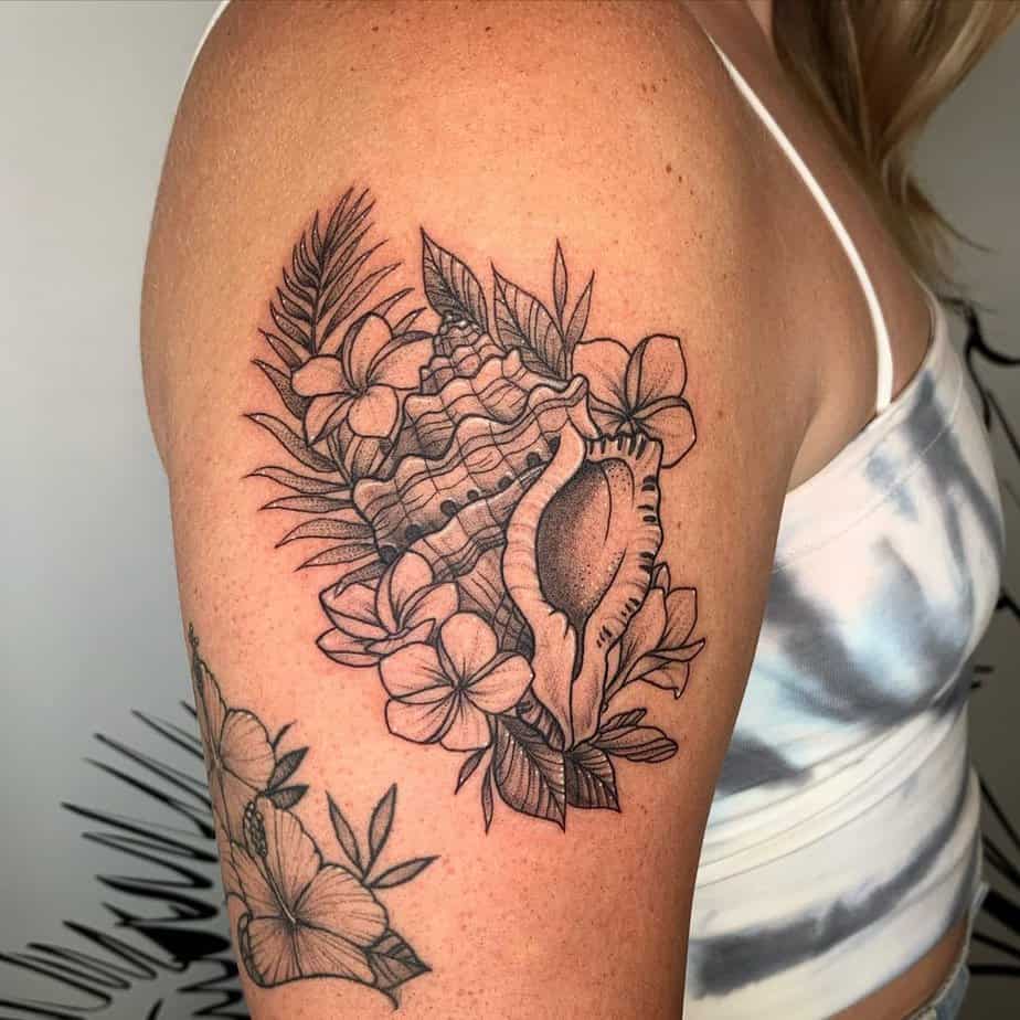Seashells and plumerias tattoo