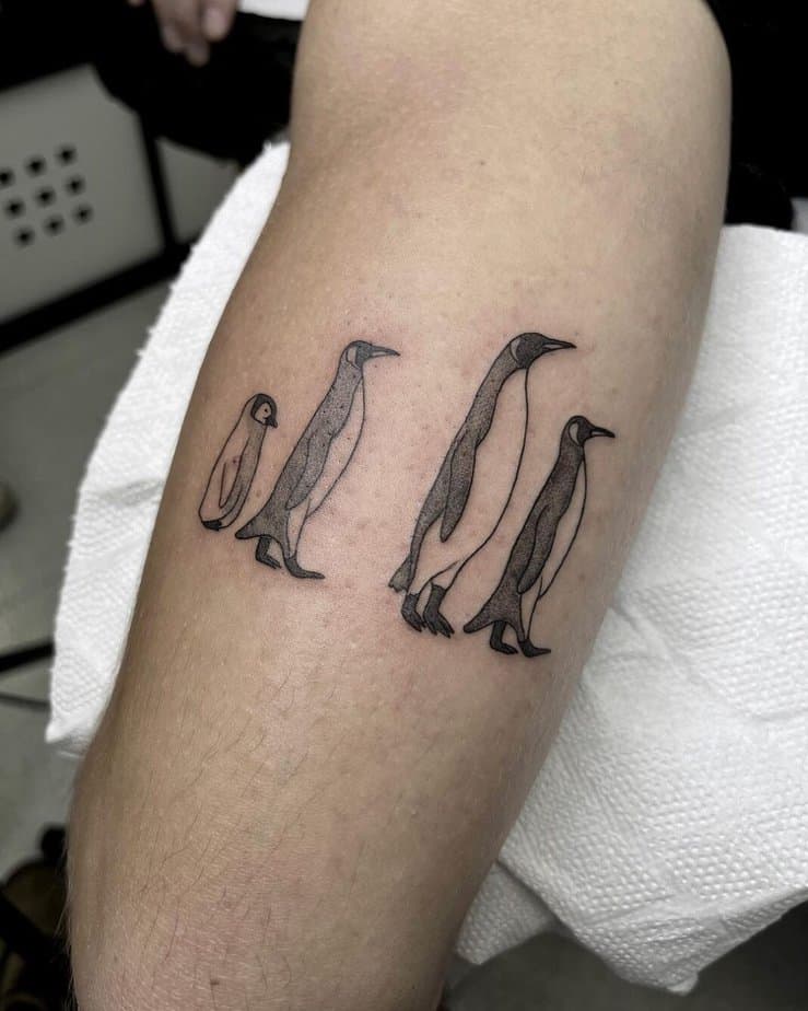Simple black and gray penguin tattoos 2