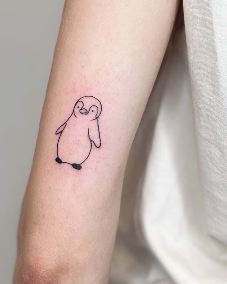 Simple black and gray penguin tattoos 5
