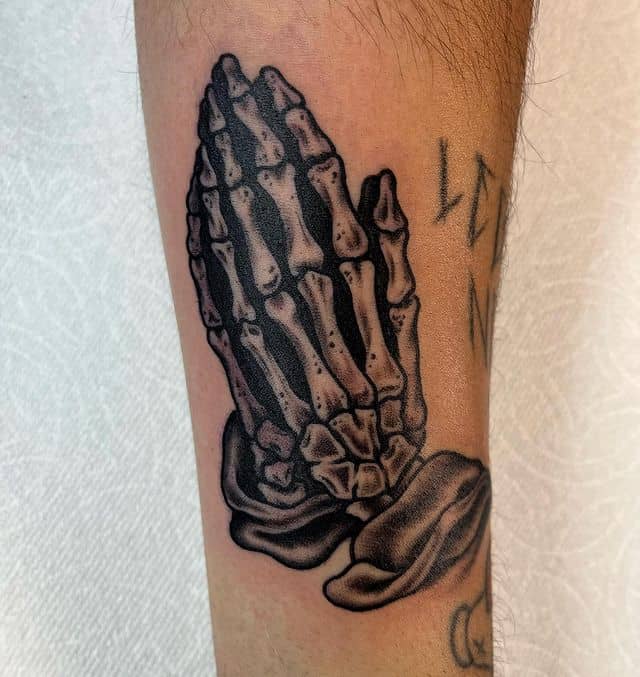 Skeleton praying hands