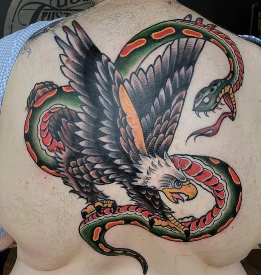 Colorful back snake and eagle tattoo