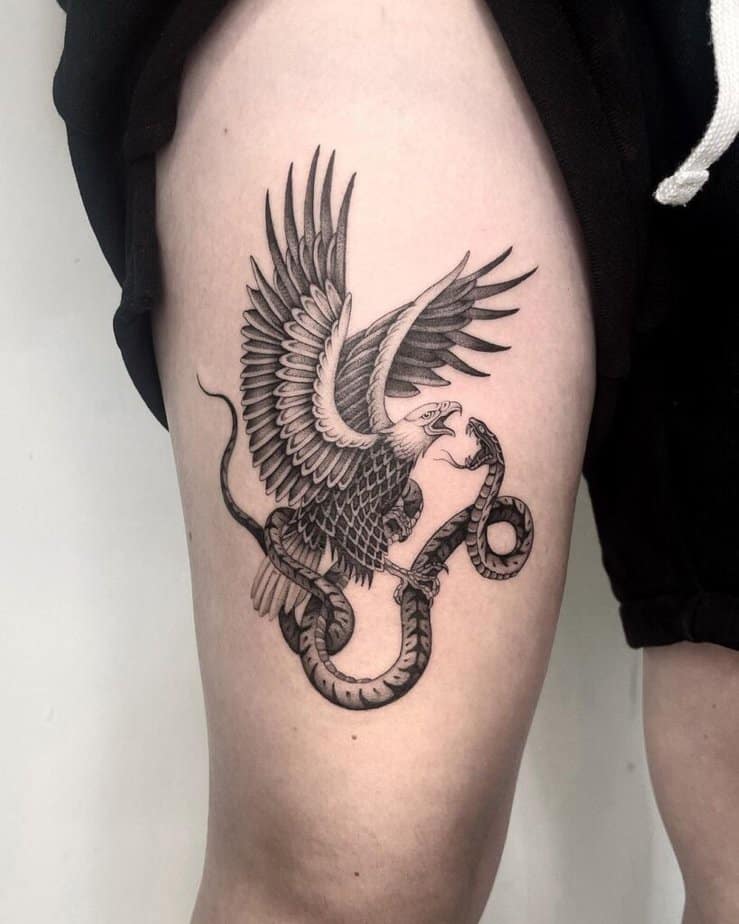 Black and gray thigh tattoo