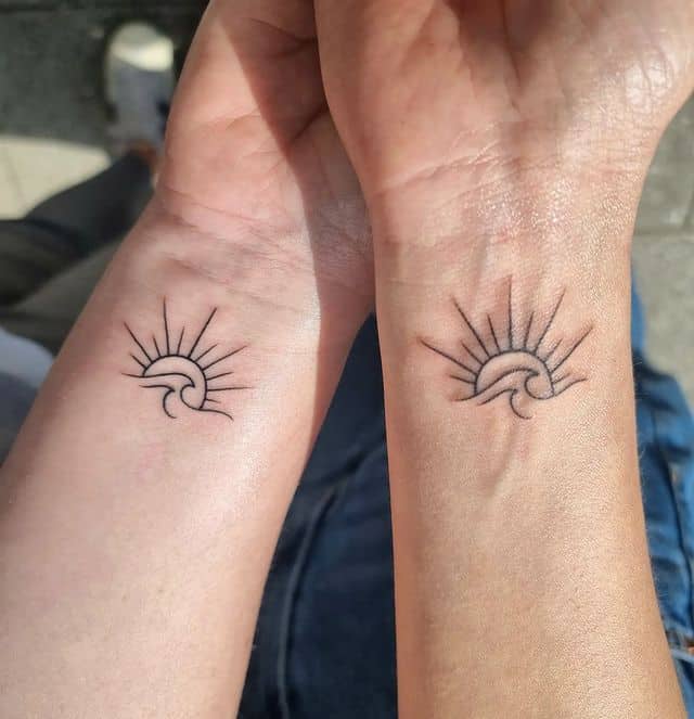 Sun and sea waves tattoo