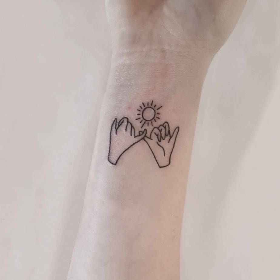Sweet sun pinky promise wrist tattoo