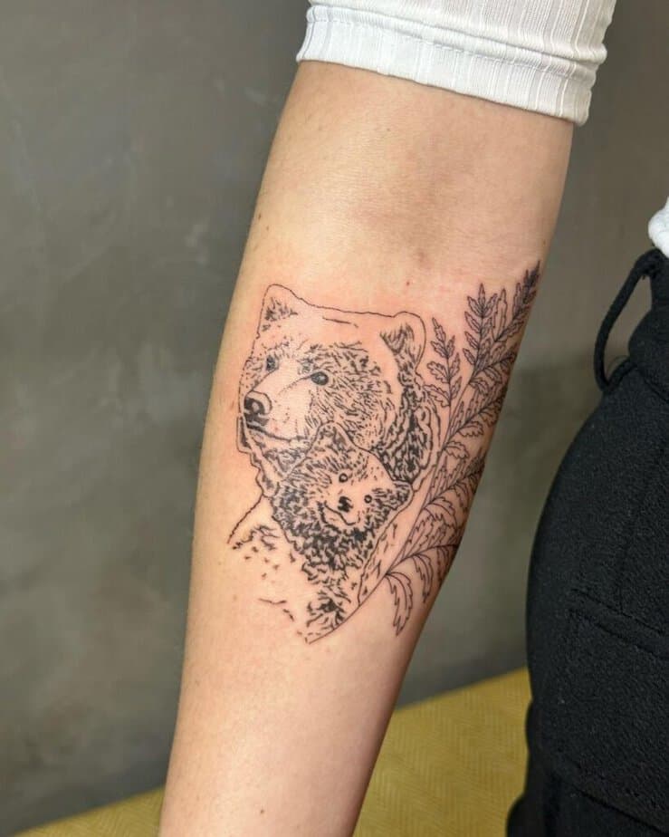 6. A bear and cub fine-line tattoo