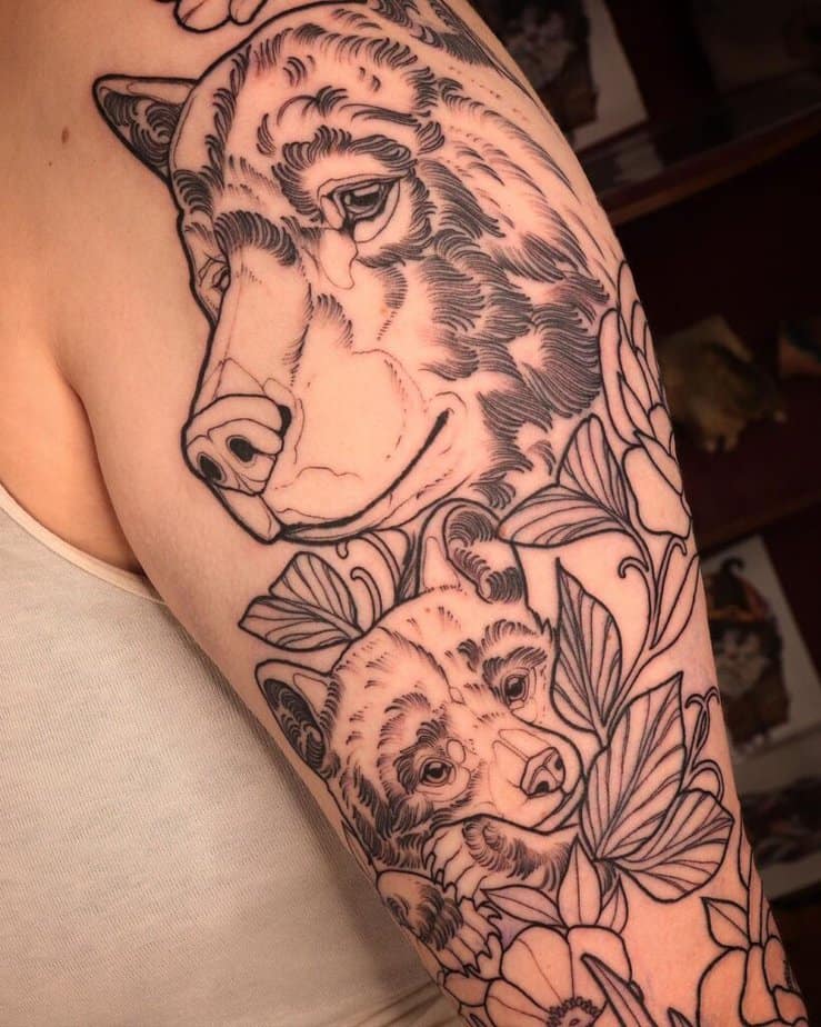 7. A bear and cub linework tattoo