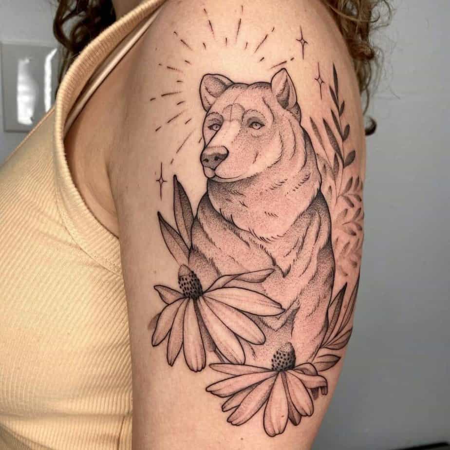 16. A black bear with flowers and plants