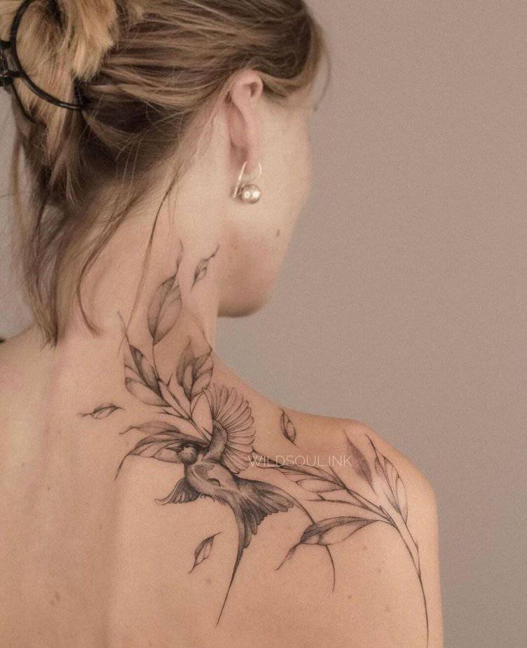Floral shoulder tattoo with birds